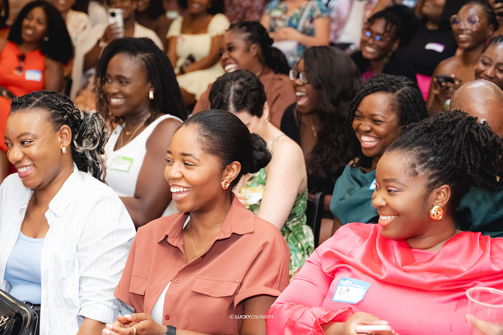 Women Smiling in Crowd